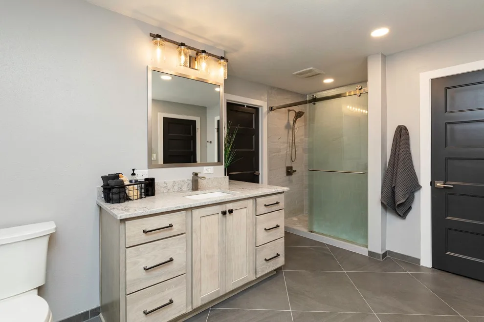 Bathroom Renovation Enhances Texture, Color, and Storage by Red House Remodeling - Photo 5