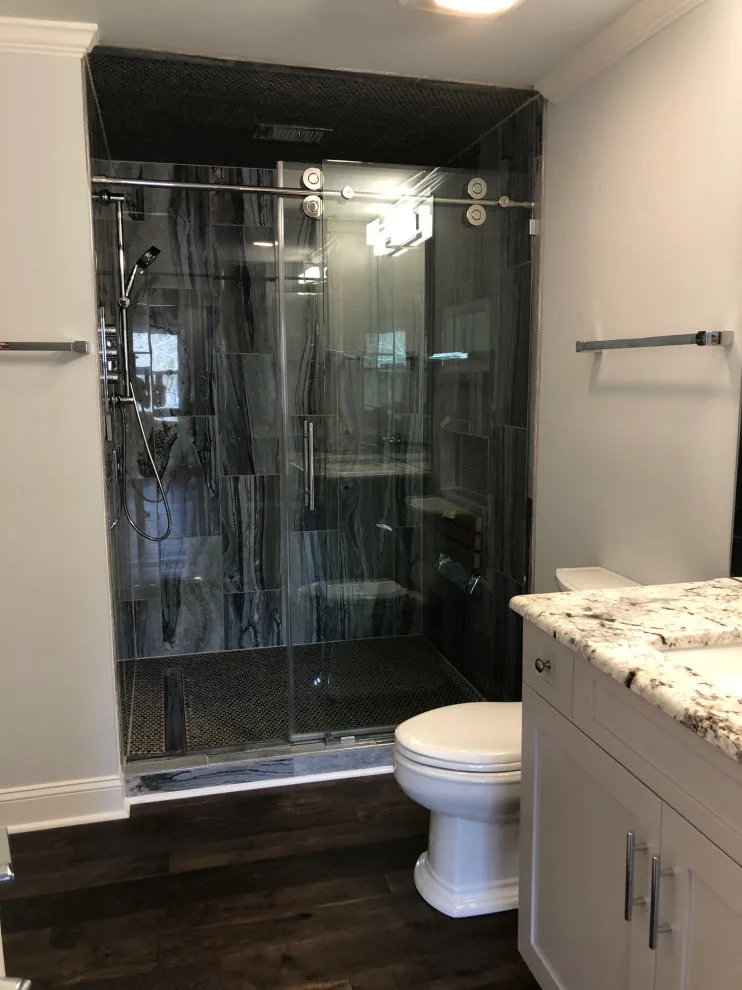 Restrooms by Dimension Design & Construction, LLC. - Photo 18