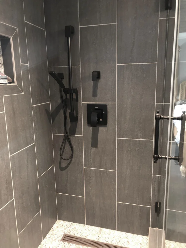 Restrooms by Dimension Design & Construction, LLC. - Photo 6