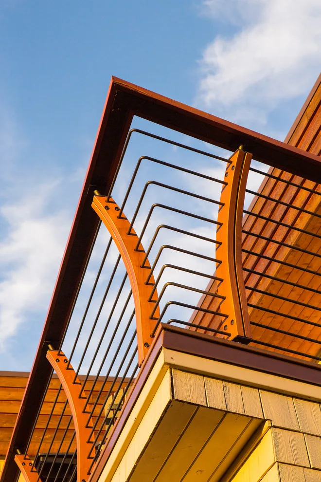 Modern deck featuring custom railings, flooring, gate, and greenhouse by Treeline Construction - Photo 9