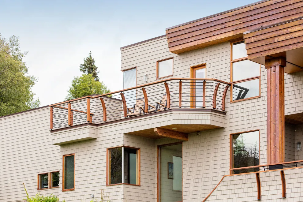 Modern deck featuring custom railings, flooring, gate, and greenhouse by Treeline Construction - Photo 3