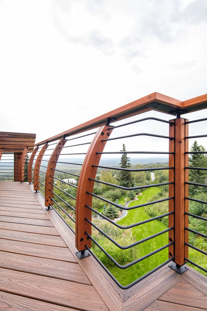 Modern deck featuring custom railings, flooring, gate, and greenhouse by Treeline Construction - Photo 21