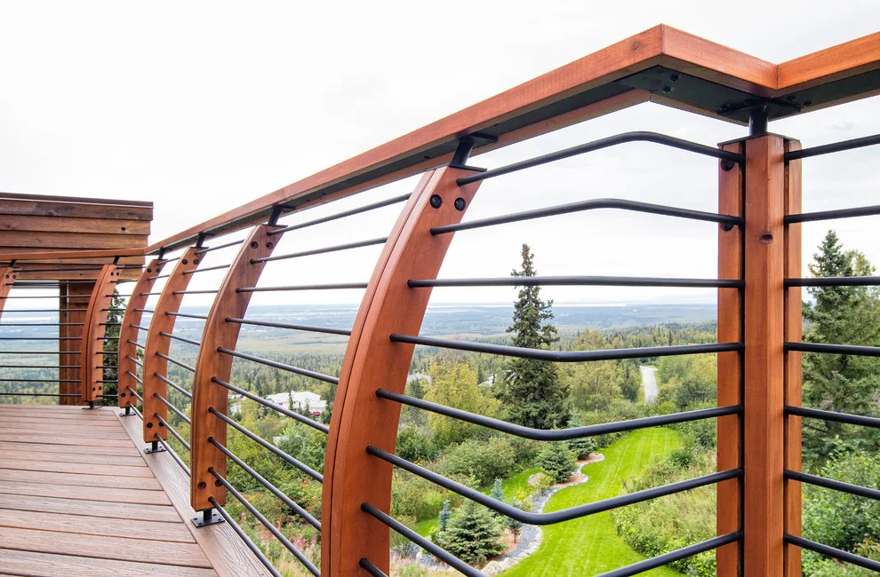 Modern deck featuring custom railings, flooring, gate, and greenhouse by Treeline Construction - Photo 35