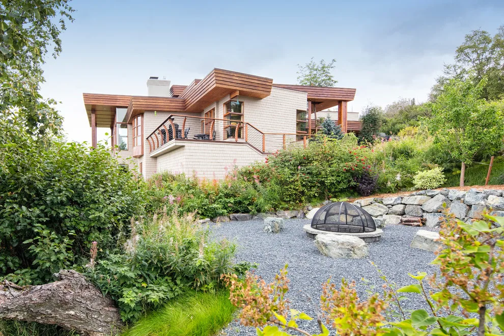 Modern deck featuring custom railings, flooring, gate, and greenhouse by Treeline Construction - Photo 52