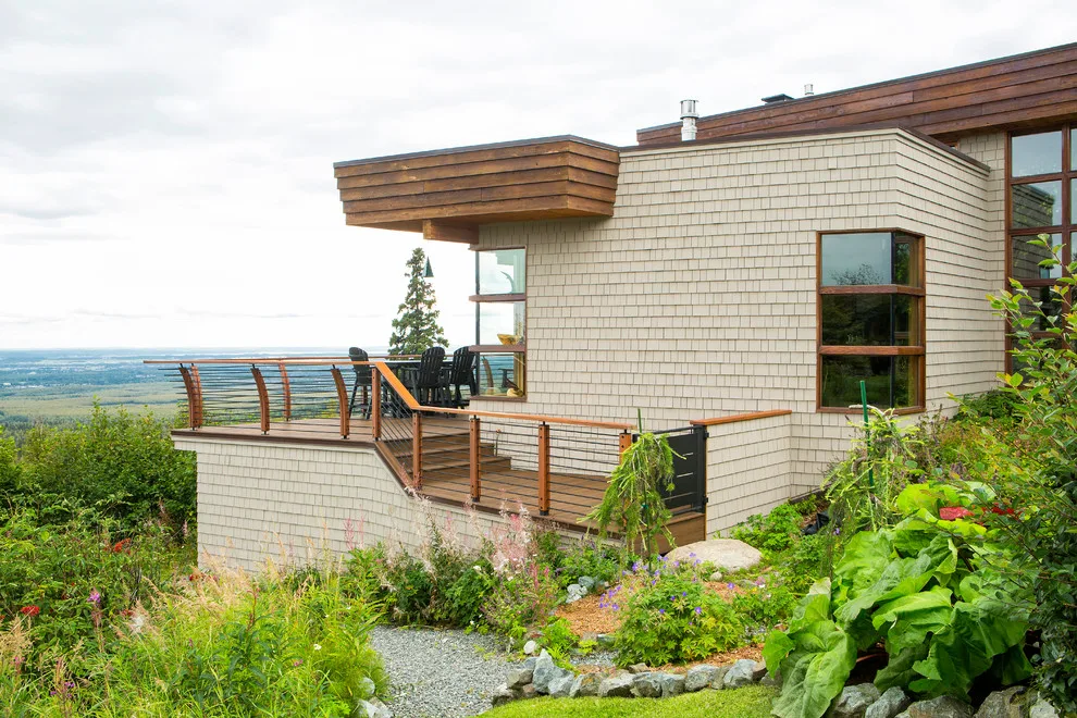 Modern deck featuring custom railings, flooring, gate, and greenhouse by Treeline Construction - Photo 43