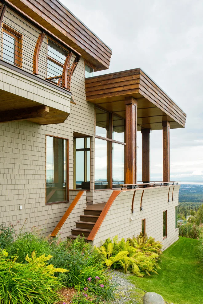 Modern deck featuring custom railings, flooring, gate, and greenhouse by Treeline Construction - Photo 47