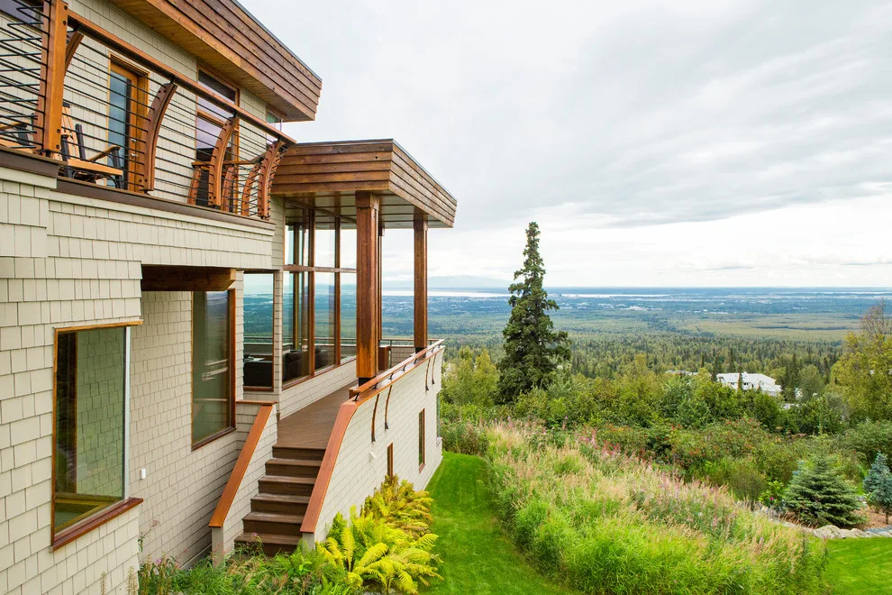 Modern deck featuring custom railings, flooring, gate, and greenhouse by Treeline Construction - Photo 17