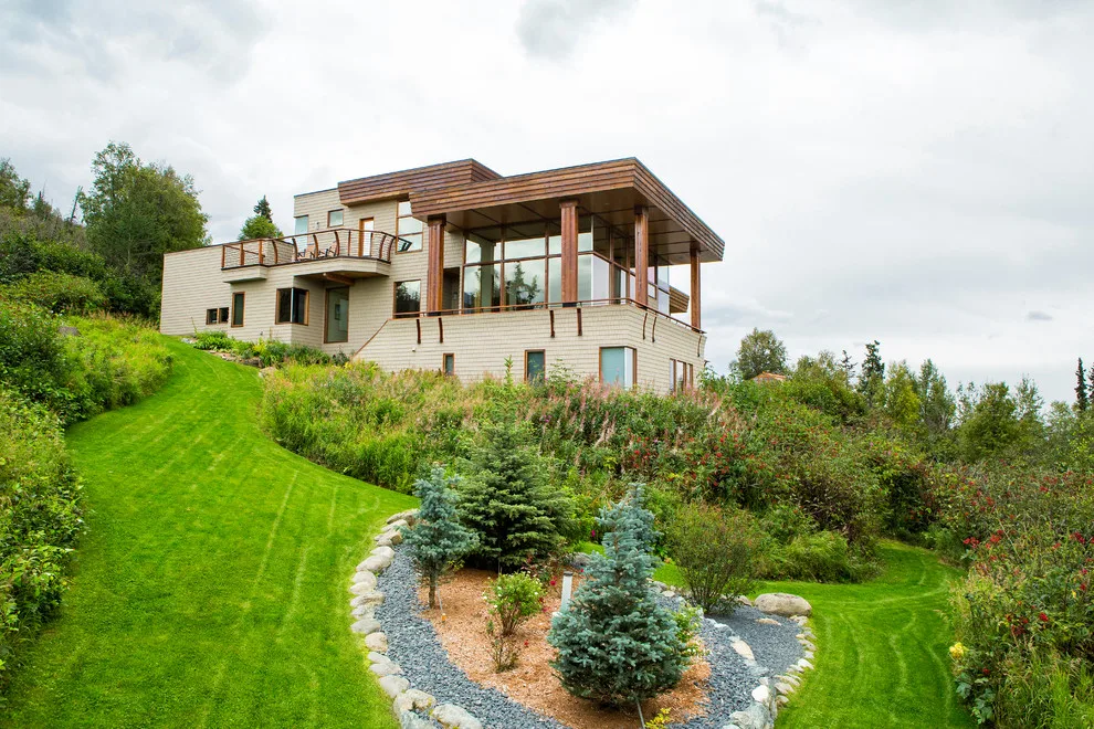 Modern deck featuring custom railings, flooring, gate, and greenhouse by Treeline Construction - Photo 12