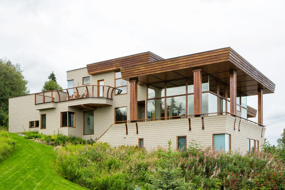 Modern deck featuring custom railings, flooring, gate, and greenhouse by Treeline Construction - Photo 5