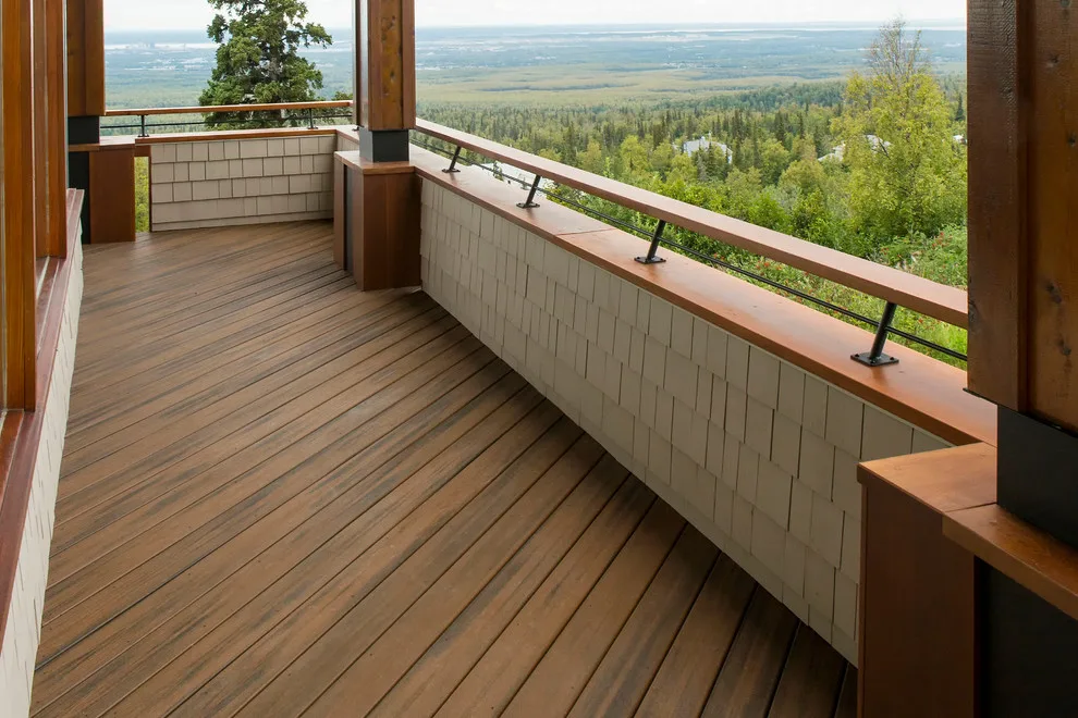Modern deck featuring custom railings, flooring, gate, and greenhouse by Treeline Construction - Photo 32