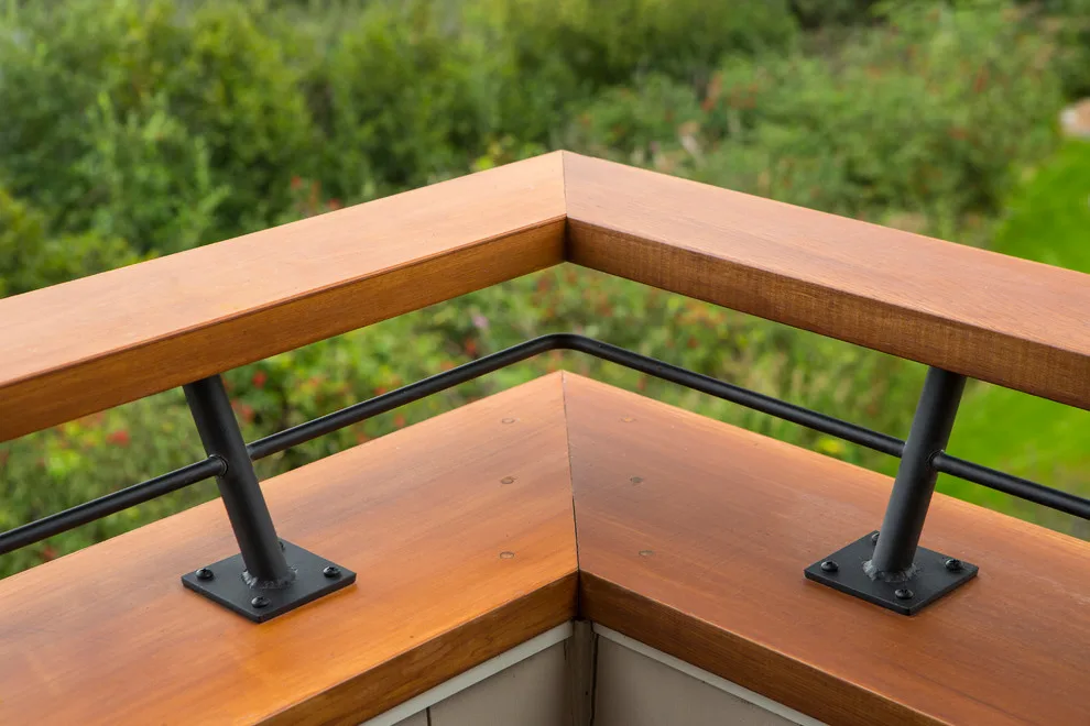 Modern deck featuring custom railings, flooring, gate, and greenhouse by Treeline Construction - Photo 38