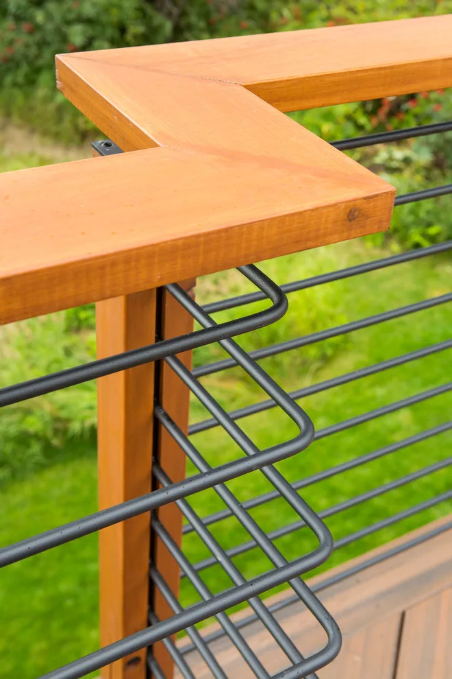 Modern deck featuring custom railings, flooring, gate, and greenhouse by Treeline Construction - Photo 56