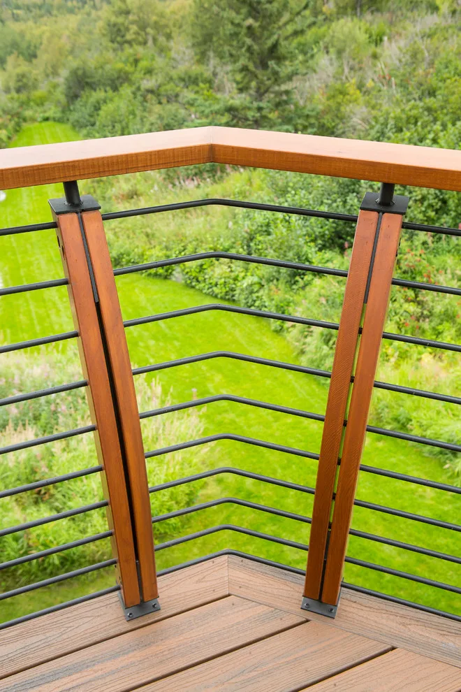 Modern deck featuring custom railings, flooring, gate, and greenhouse by Treeline Construction - Photo 55
