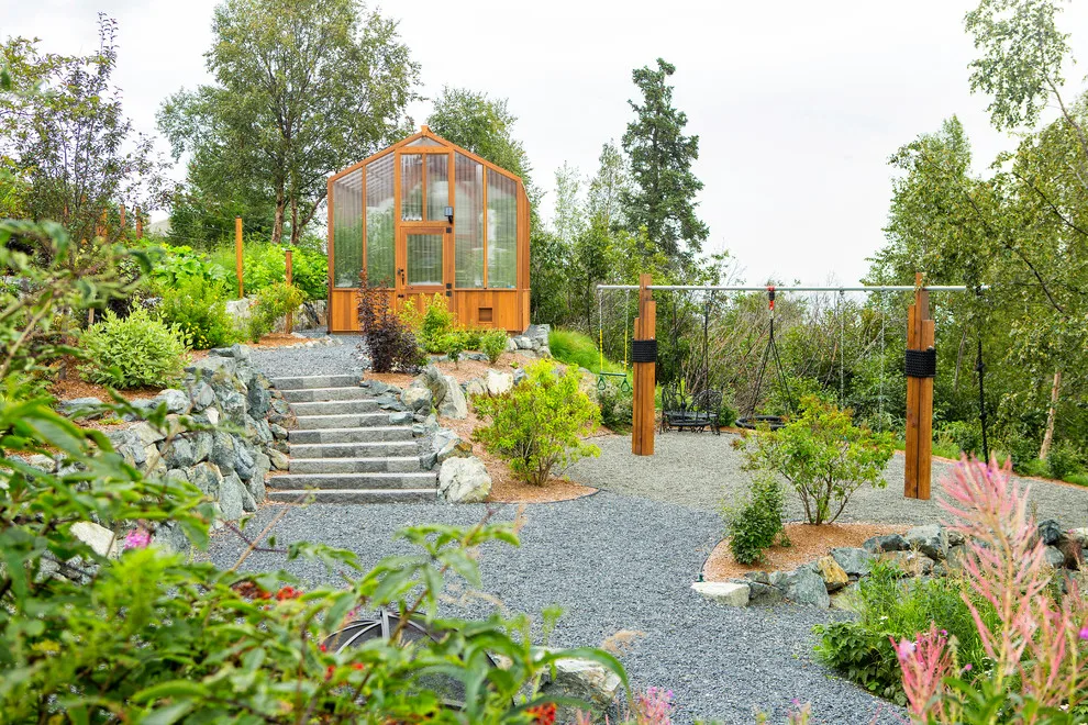 Modern deck featuring custom railings, flooring, gate, and greenhouse by Treeline Construction - Photo 42