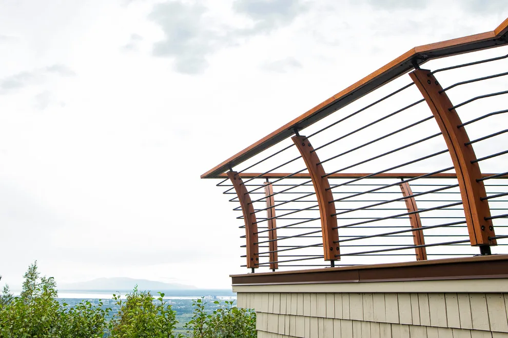 Modern deck featuring custom railings, flooring, gate, and greenhouse by Treeline Construction - Photo 31