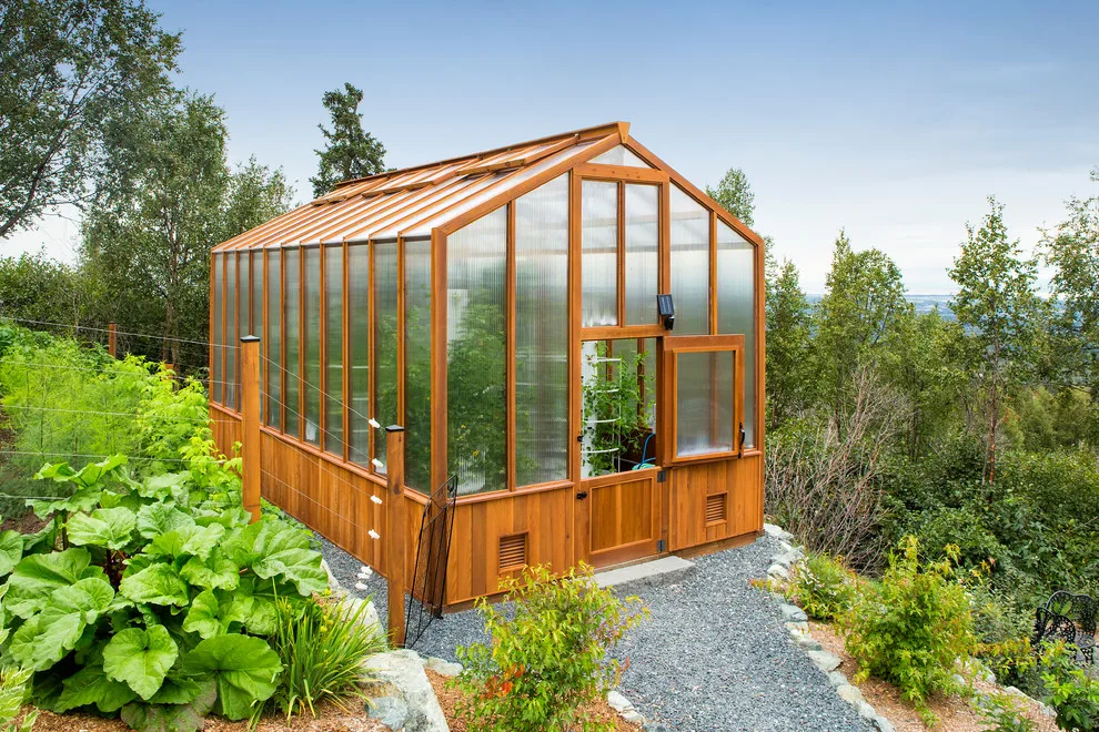 Modern deck featuring custom railings, flooring, gate, and greenhouse by Treeline Construction - Photo 40