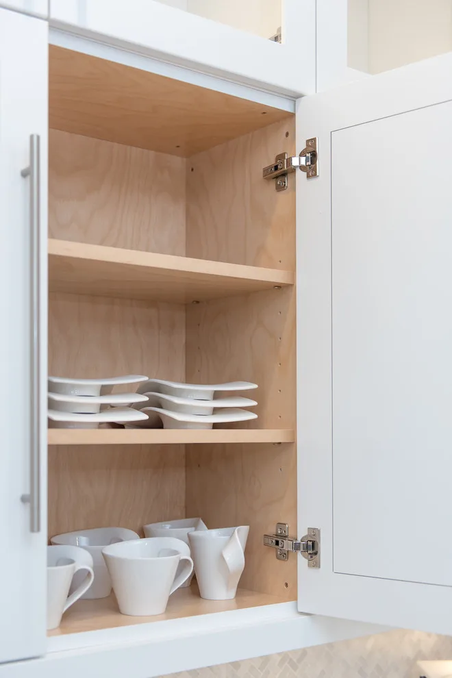 Serene White Kitchen by Labra Design Build - Photo 12