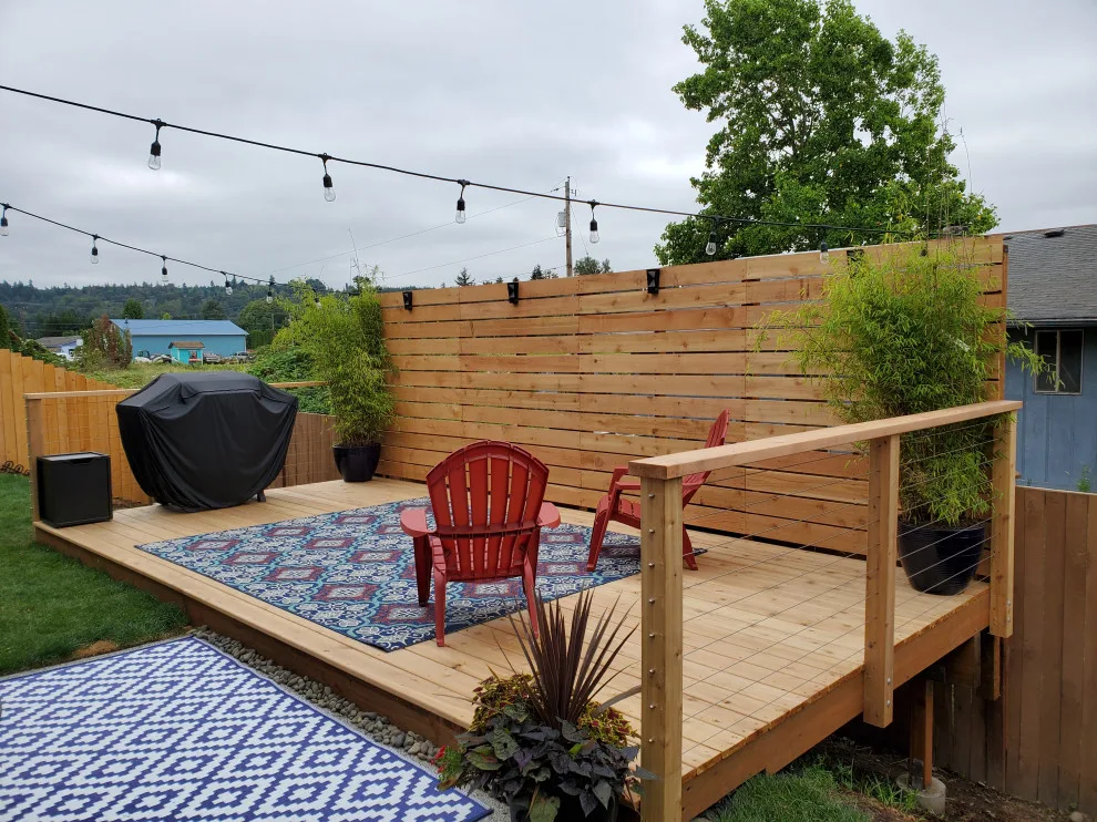 outdoor deck with privacy barrier and low fencing by Teaham Construction - Photo 4