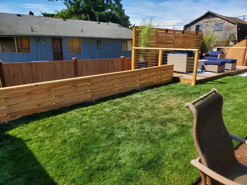 outdoor deck with privacy barrier and low fencing by Teaham Construction - Photo 2