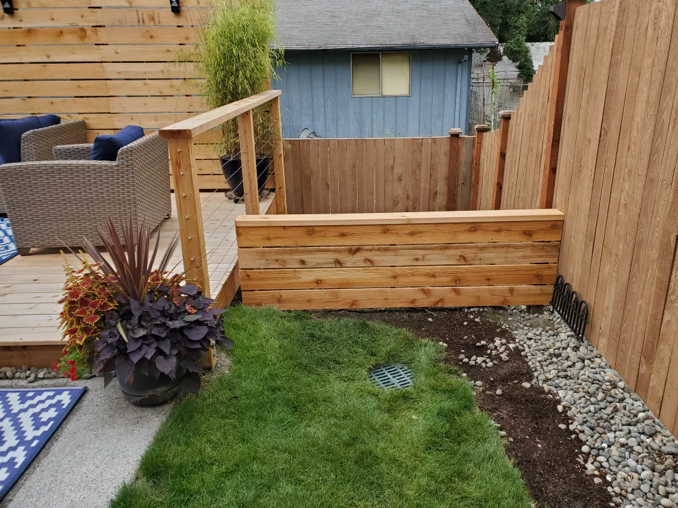 outdoor deck with privacy barrier and low fencing by Teaham Construction - Photo 3