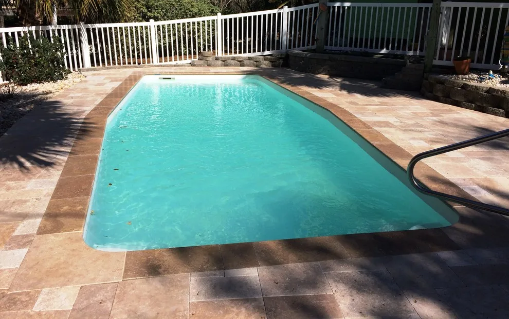 Emerald Isle pool makeover - converting old concrete deck to travertine by Yardworks, Inc. - Photo 3