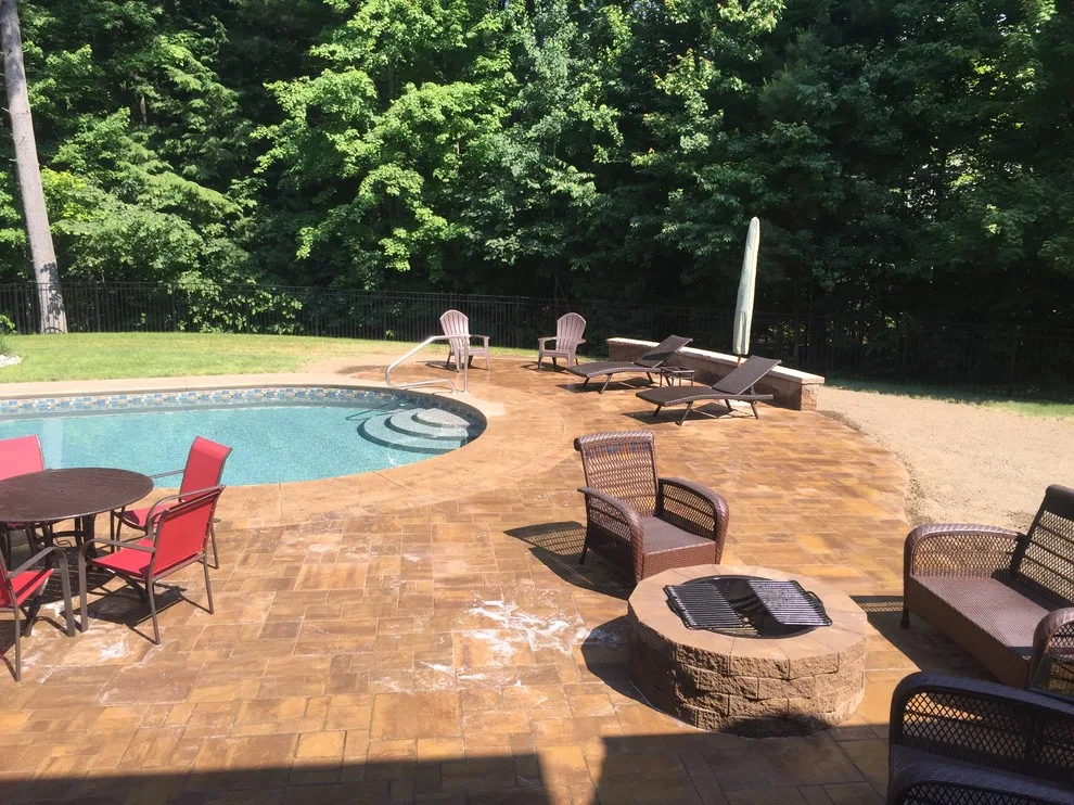Patio Pool Deck with Seating Wall and Fire Pit by Arborcare Landscape Services & Products, LLC. - Photo 5