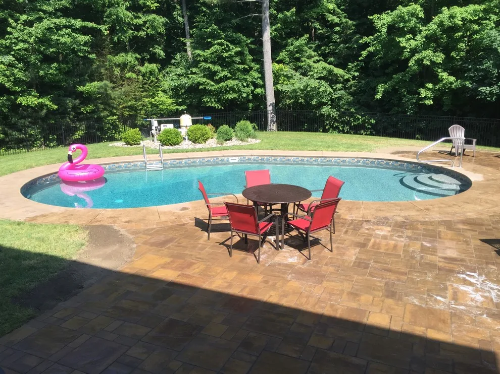 Patio Pool Deck with Seating Wall and Fire Pit by Arborcare Landscape Services & Products, LLC. - Photo 2
