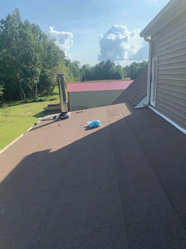 Installation of flat roofing by Roof MD - Photo 6