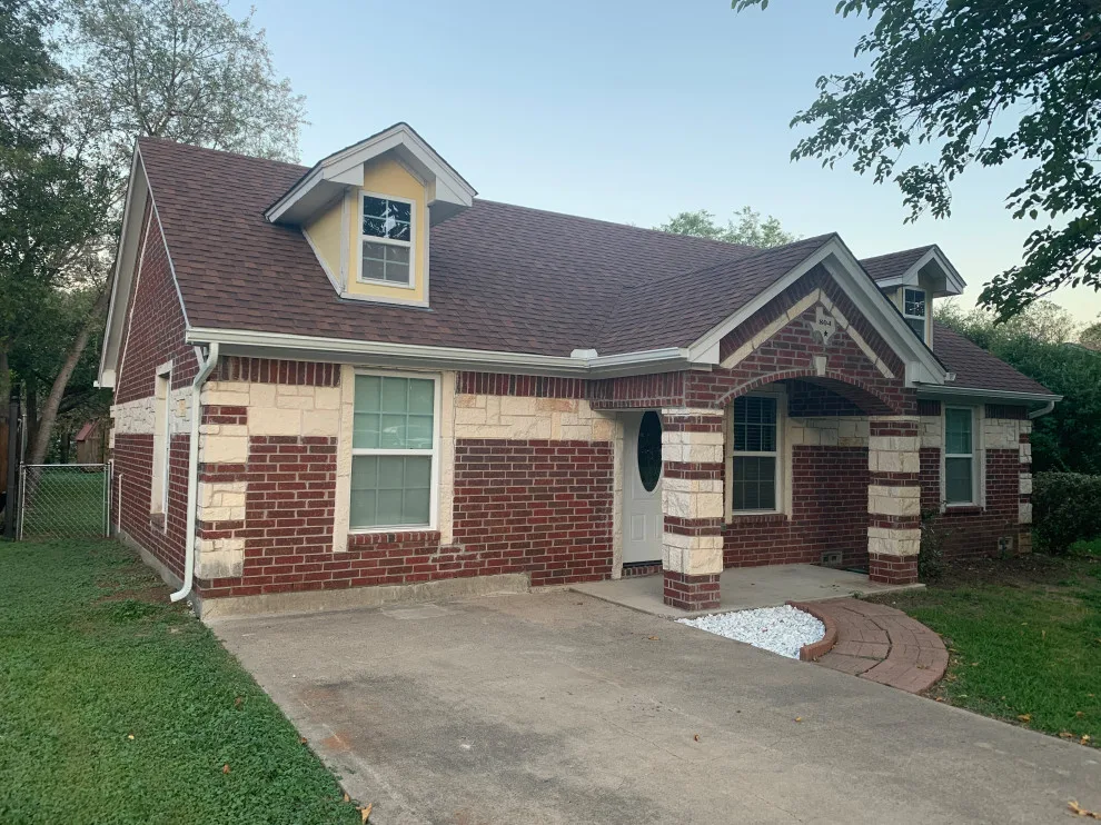 Renovated house featuring new gutters by Sharp Seamless Gutter - Photo 3