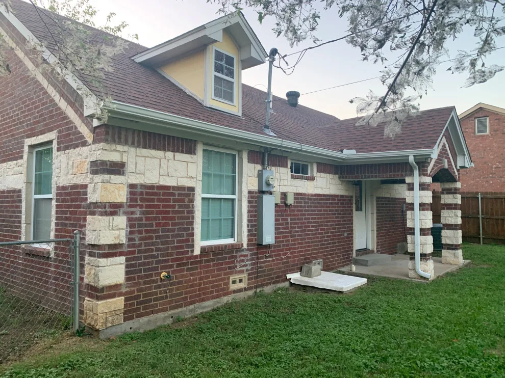 Renovated house featuring new gutters by Sharp Seamless Gutter - Photo 2