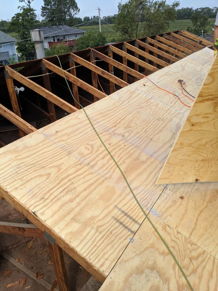 Roof replacement assembly by AJ Exteriors & Roofing Inc. - Photo 3