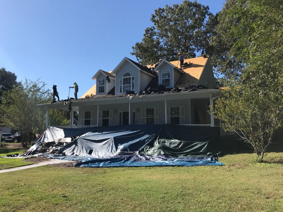 Porch-Encircled Farmhouse by Patriot Roofing Company - Photo 2