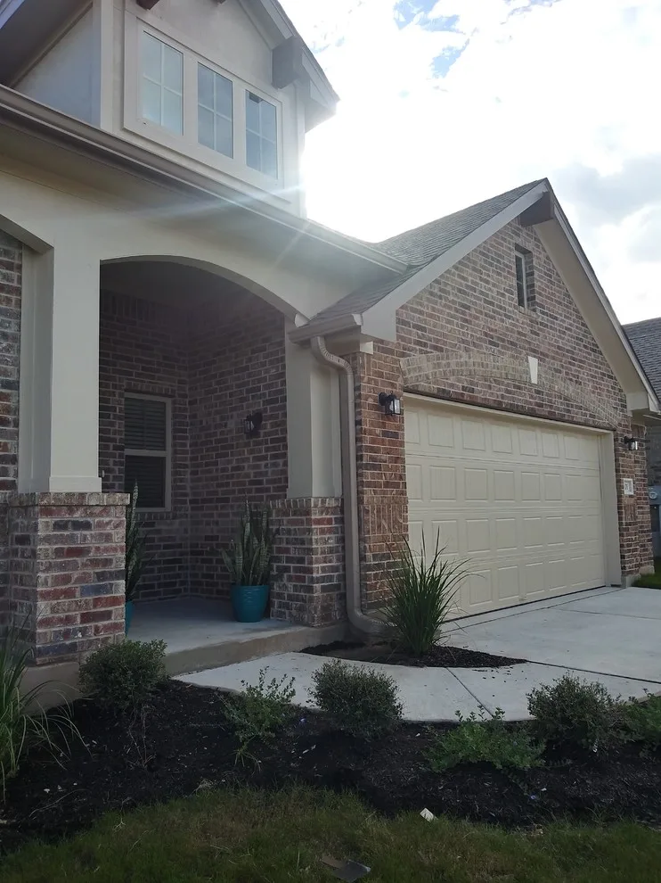 Gutter Setup on Brick House in Hutto, TX by Gutter Tex - Photo 4