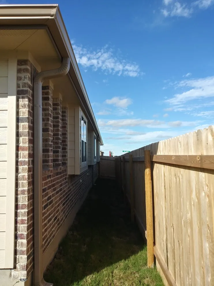 Gutter Setup on Brick House in Hutto, TX by Gutter Tex - Photo 2