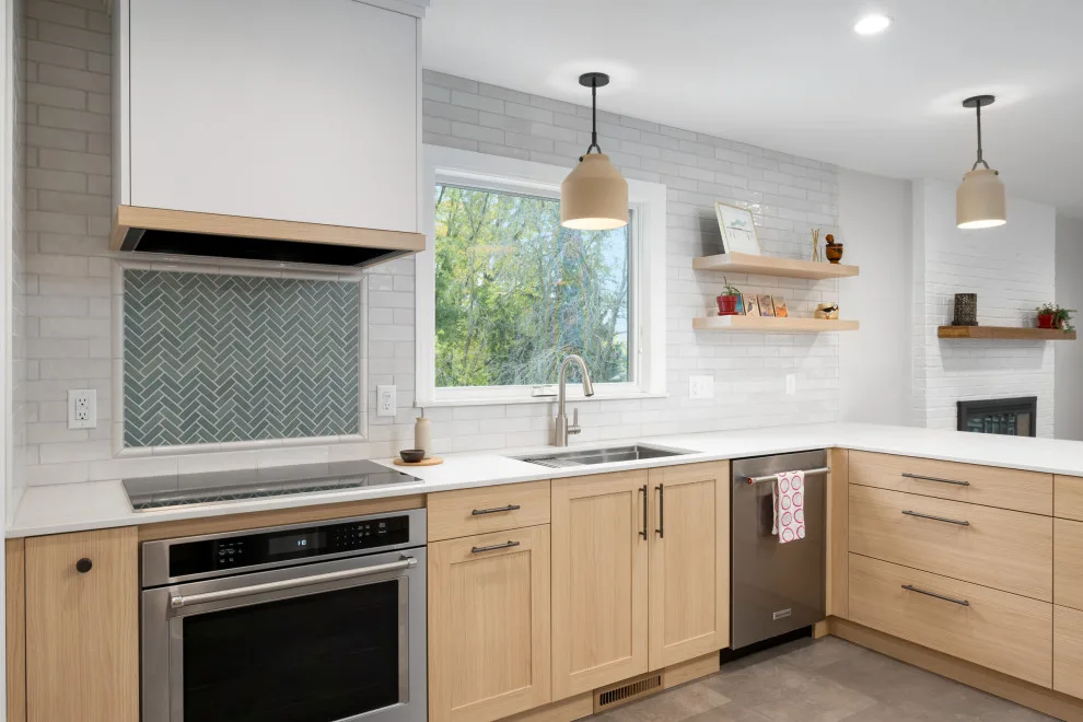 Stylish Sage and Gray Kitchen by Wise Design & Remodel LLC - Photo 12