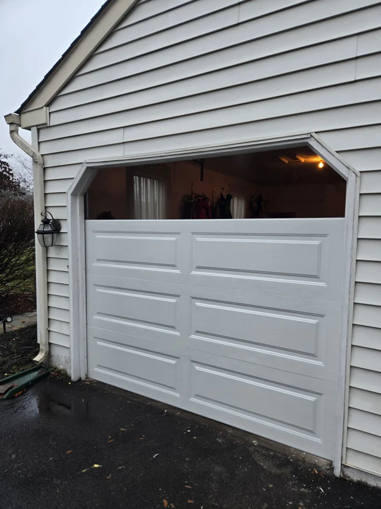 Two garage doors and openers by Charming Exteriors, LLC - Photo 17