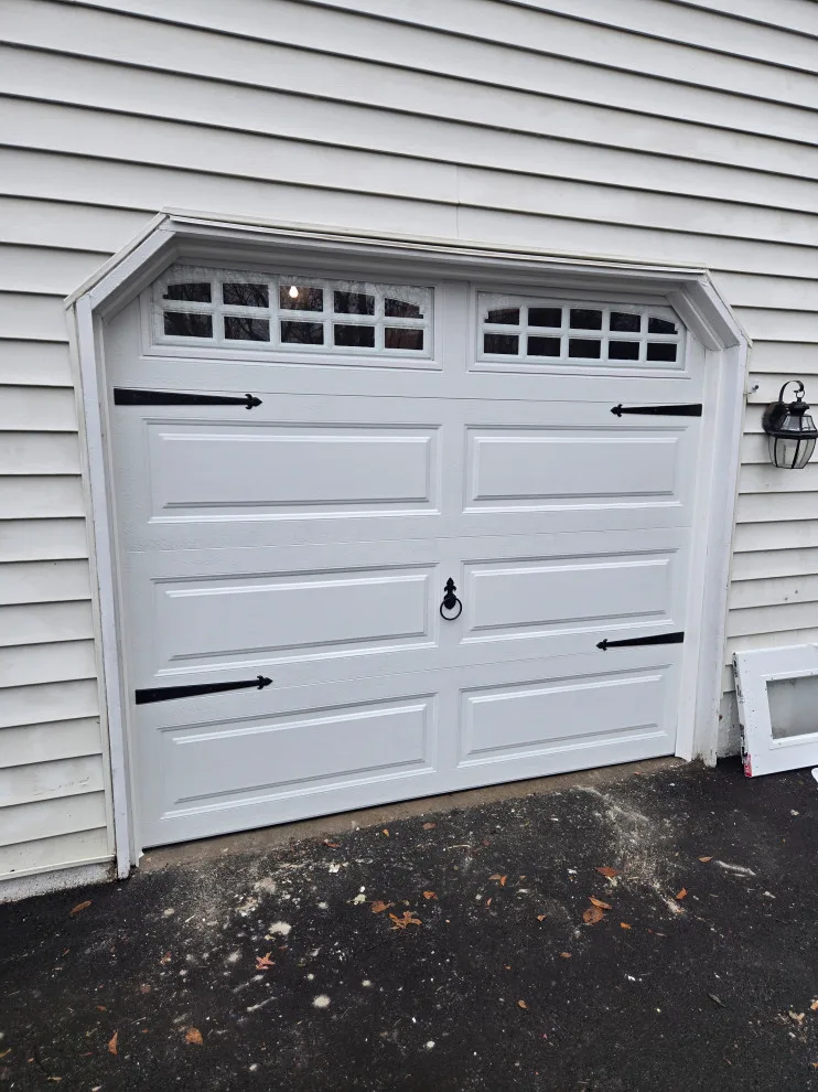 Two garage doors and openers by Charming Exteriors, LLC - Photo 13