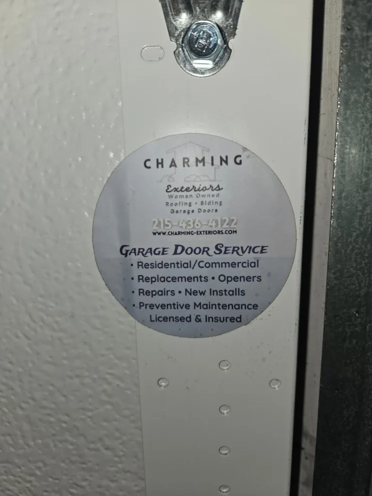 Two garage doors and openers by Charming Exteriors, LLC - Photo 19