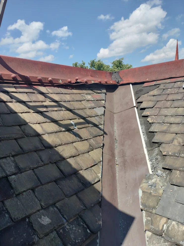 Slate roof refurbishment by Charming Exteriors, LLC - Photo 2