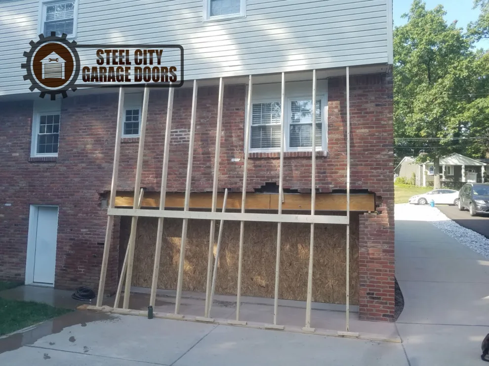Transform two garage doors into one single door by Steel City Garage Doors - Photo 5