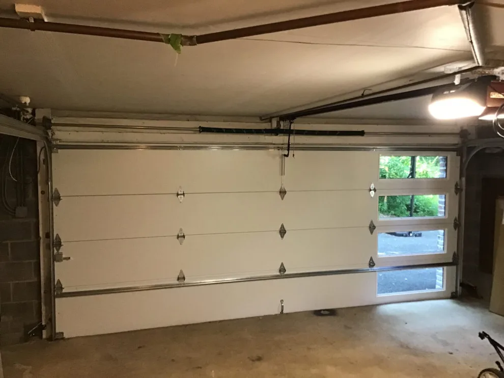 Walnut Flush Panel Garage Door by Precision Garage Door Service - Photo 3