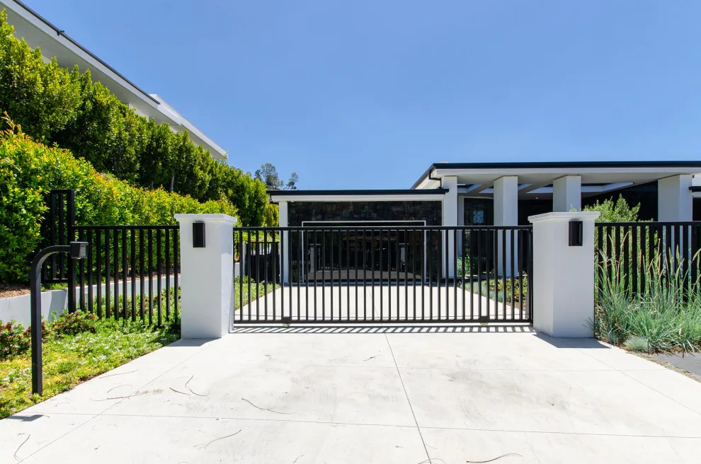 Contemporary Steel Gates and Panoramic Frameless Glass Garage Door by Pacific Garage Doors & Gates - Photo 8