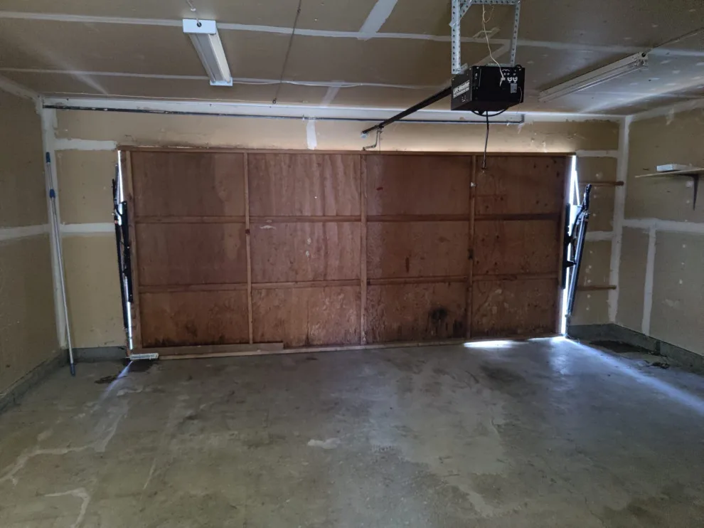 Single panel wooden door restoration by Allroads Overhead Garage Doors - Photo 3