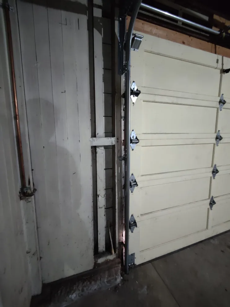 Single panel wooden door restoration by Allroads Overhead Garage Doors - Photo 8