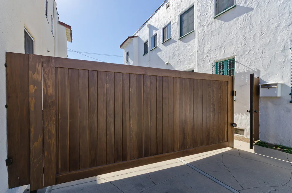 West Hollywood wooden gates and corresponding garage door by Pacific Garage Doors & Gates - Photo 2