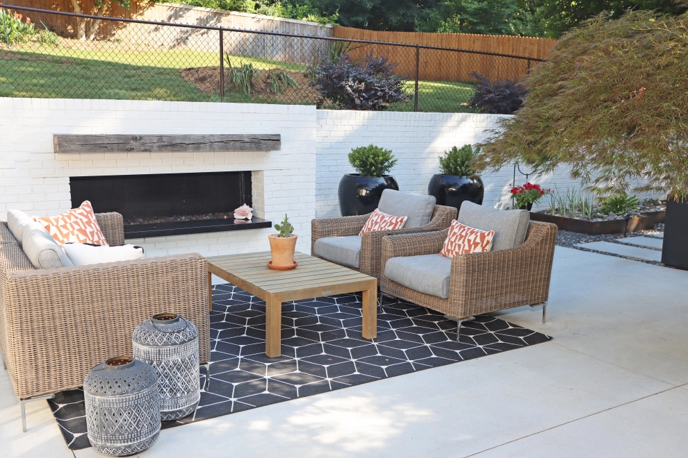 Modern patio with fireplace by City Garden Company - Photo 9