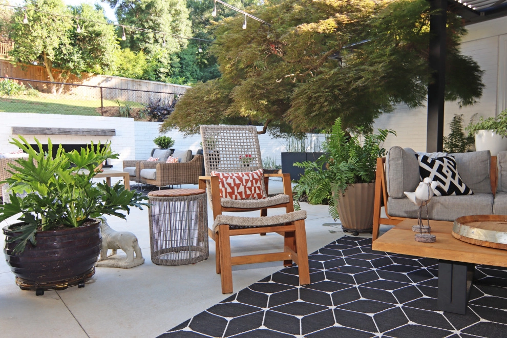 Modern patio with fireplace by City Garden Company - Photo 7