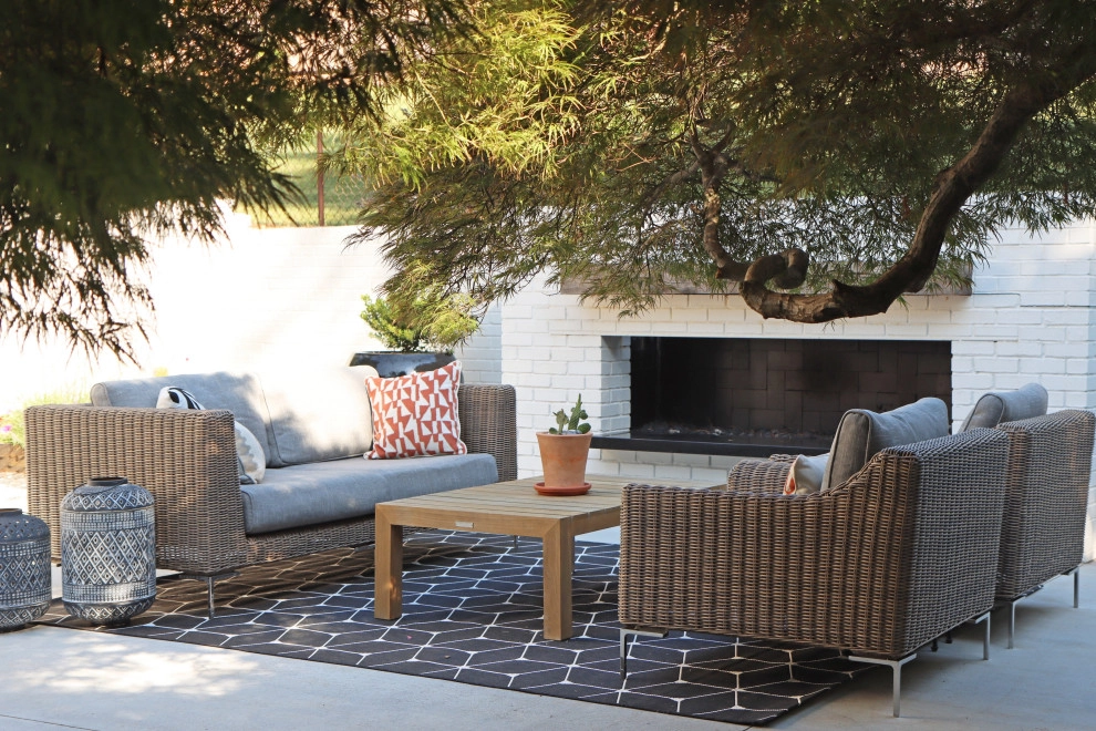 Modern patio with fireplace by City Garden Company - Photo 8