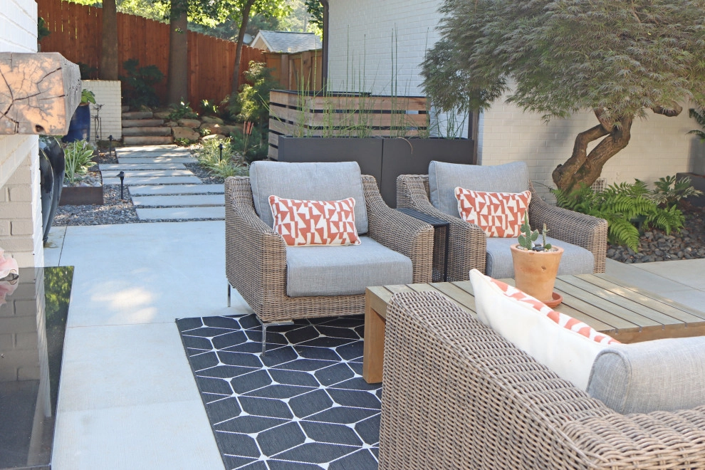 Modern patio with fireplace by City Garden Company - Photo 6