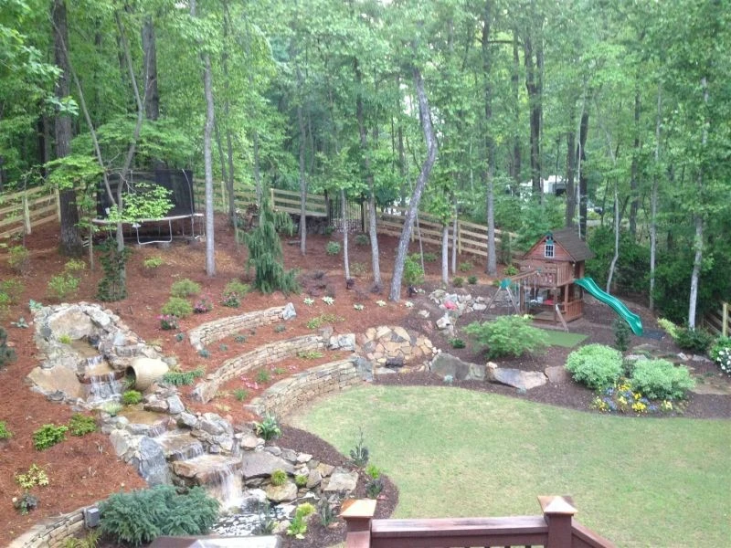 Back Yard Lanscaping by Property Masters Landscape And Design - Photo 5